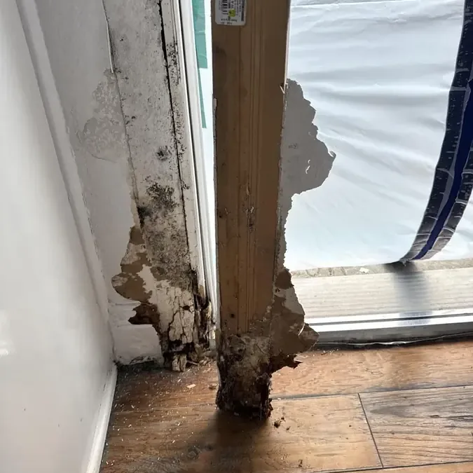 Corroded pipe leak traced at the base of a wall